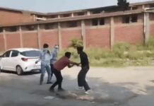 पानीपत में बीच सड़क युवक पर हमला, चलती बाइक से गिराकर लाठी-डंडों और बेल्ट से पीटा; VIDEO वायरल Panipat Viral Video,